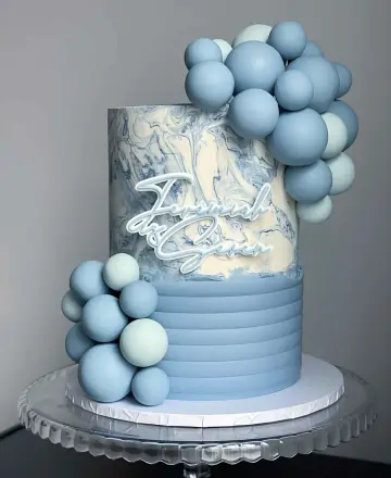 Balloon-adorned blue birthday celebration cake